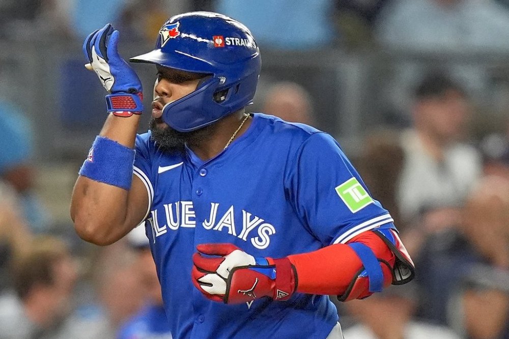 Toronto Blue Jays' Vladimir Guerrero Jr. reacts as he rounds the bases after hitting a two-run home run against the New York Yankees during the first inning of Game 3 of baseball's American League Division Series, Tuesday, Oct. 7, 2025, in New York. (AP Photo/Frank Franklin II)