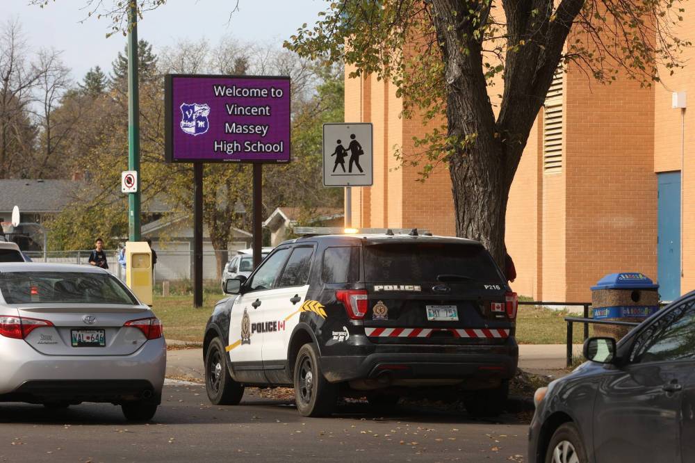 A Brandon Police Service vehicle is parked under the school sign after police responded to an 'unverified threat