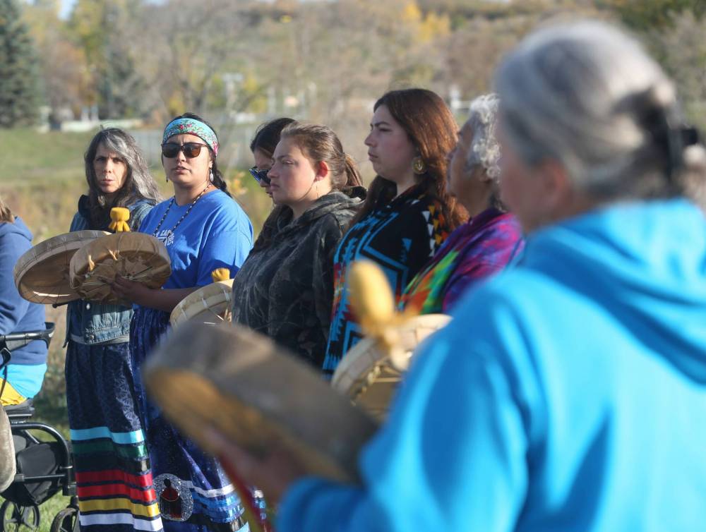 The Women’s song is performed as part of the Sisters in Spirit petal ceremony at the Riverbank Discovery Centre on Saturday.