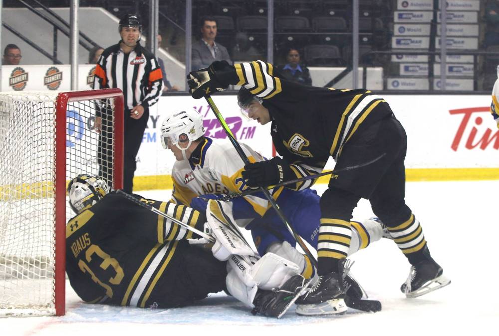 Brandon Wheat Kings goalie Jayden Kraus (33) tumbles into the net with Saskatoon Blades forward Triston Mitchell-McElhone (25) and Wheat Kings defenceman Gio Pantelas (84) during Western Hockey League action at Assiniboine Credit Union Place on Sunday afternoon. (Perry Bergson/The Brandon Sun)
Oct. 5, 2025