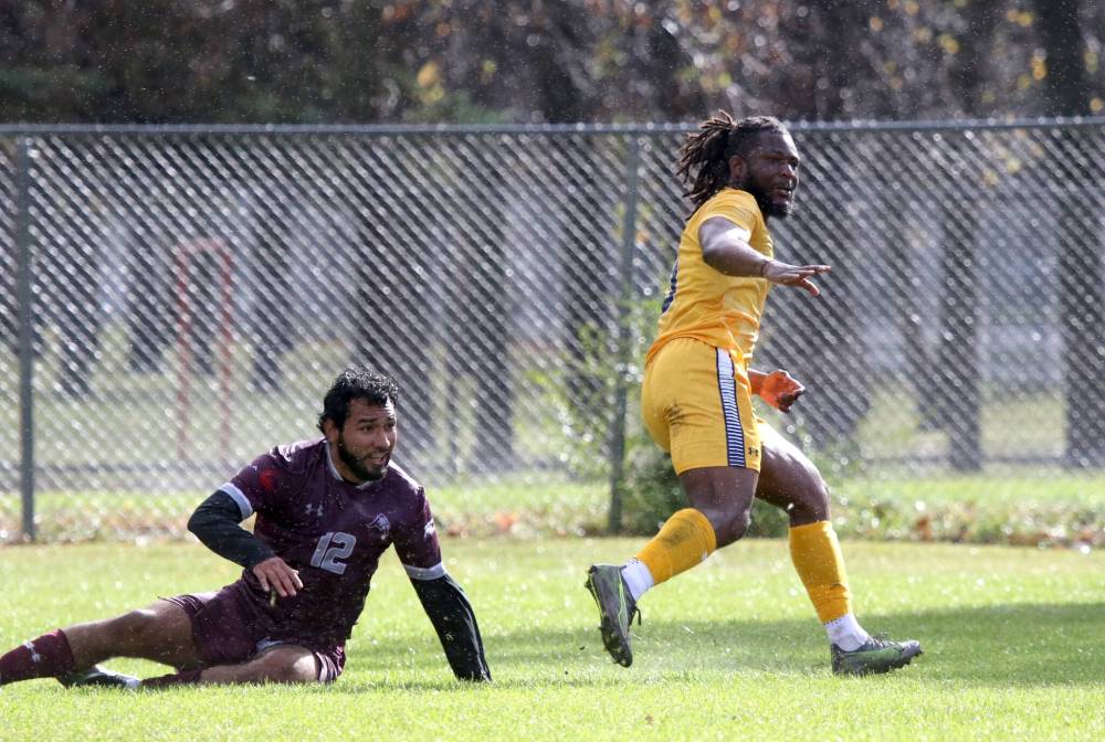 T.J. Bodunrin watches his game-winning goal find the net for the Brandon University Bobcats in Saturday's MCAC men's soccer game against the Assiniboine College Cougars. (Thomas Friesen/The Brandon Sun)