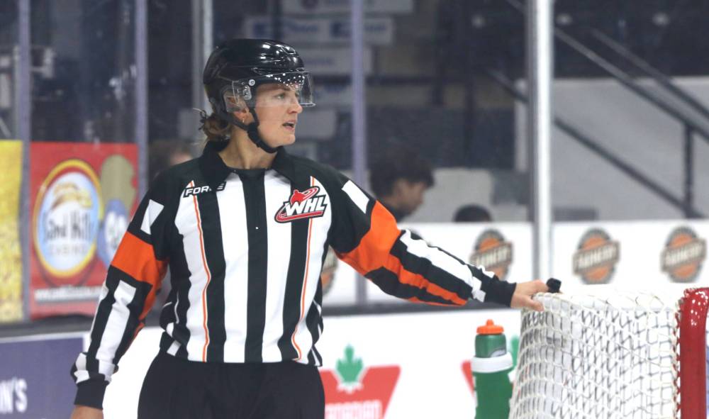 Referee Alex Clarke watches as the Brandon Wheat Kings and Saskatoon Blades put fresh players on the ice after a whistle during Western Hockey League action at Assiniboine Credit Union Place on Sunday afternoon. Clarke became both the first female linesman and referee for the league when she broke the gender barrier in 2021. (Perry Bergson/The Brandon Sun)
