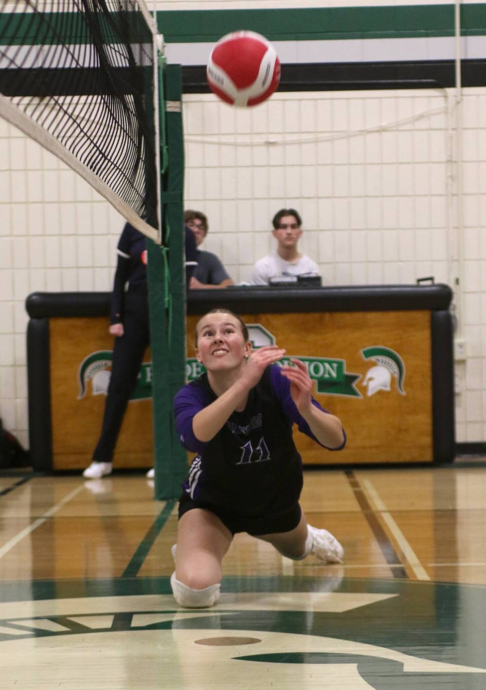 Vincent Massey setter Kaitlyn Couckuyt dives to save a ball after it hit the net against the Neelin Spartans. (Thomas Friesen/The Brandon Sun)