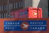 A Canada Post vehicle sits outside a facility in Ottawa last month. (The Canadian Press files)