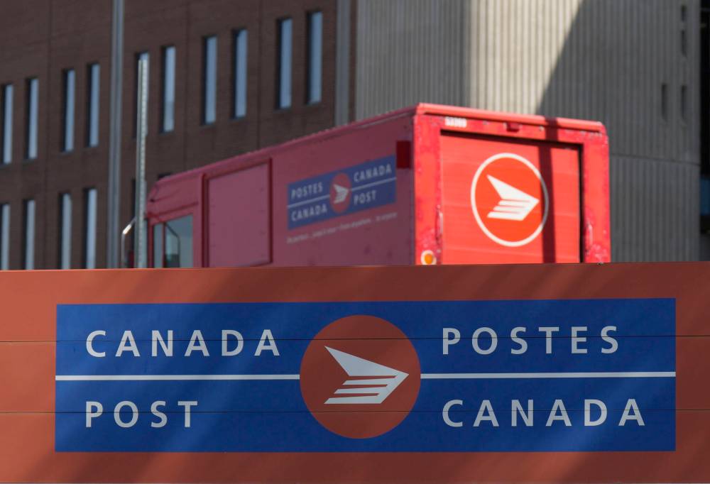 A Canada Post vehicle sits outside a facility in Ottawa last month. (The Canadian Press files)