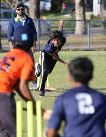 Dev Shah bowls for Meadows against Maryland Park during Brandon’s first-ever junior high cricket match at Meadows School on Wednesday. (Thomas Friesen/The Brandon Sun)