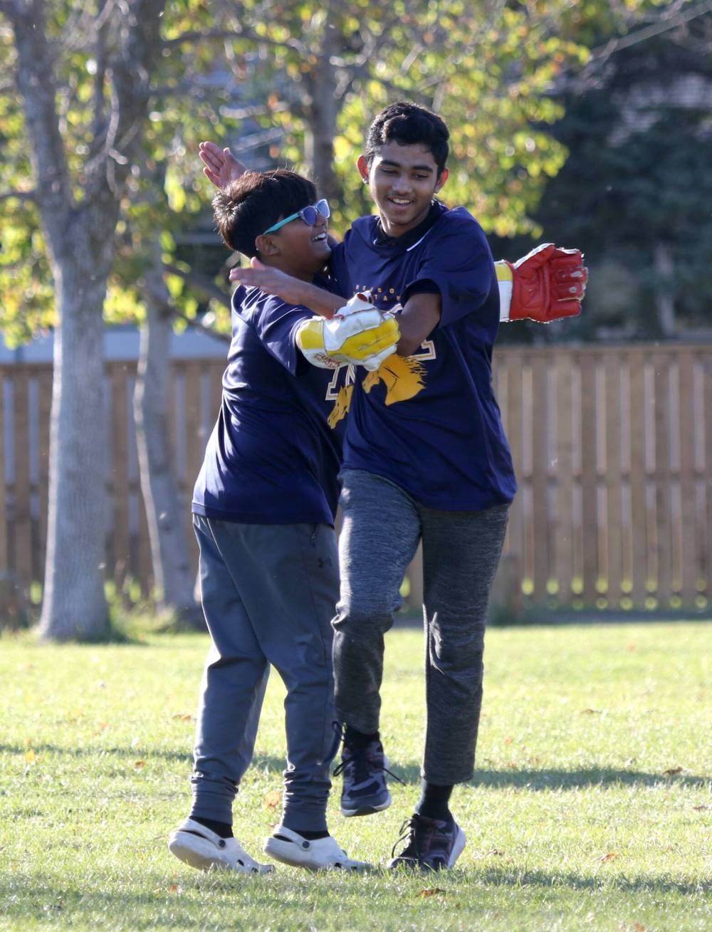 Meadows School player celebrate an out during Wednesday’s game. (Thomas Friesen/The Brandon Sun)