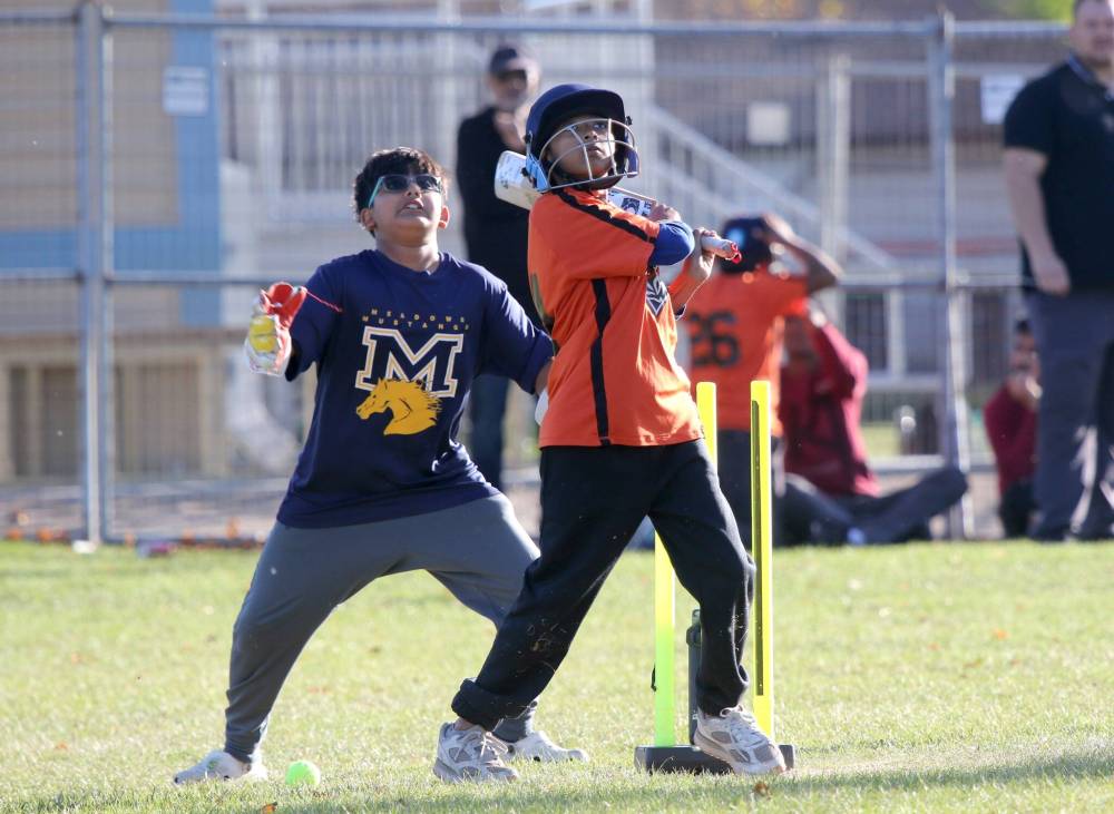 A Maryland Park batsman watches the ball fly off his bat. (Thomas Friesen/The Brandon Sun)
