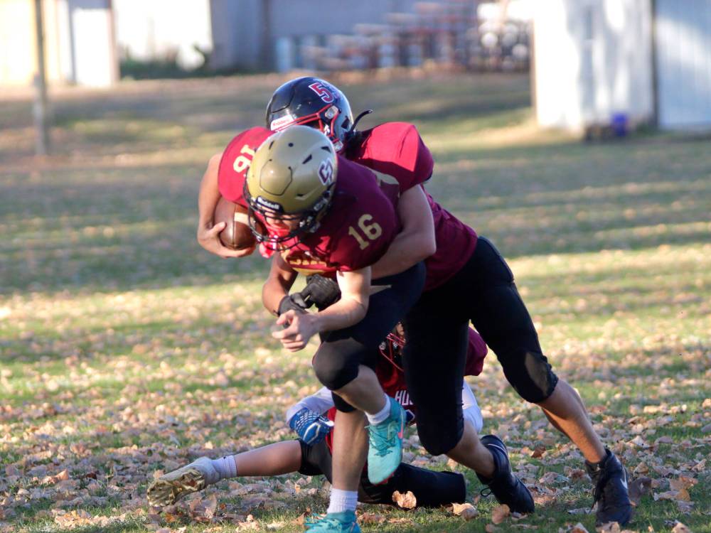 Crocus Plainsmen Kayven Brown (16) gets taken down down by Sturgeon Heights’ Taylor Knox (53) during JV Winnipeg High School Football League action at Crocus on Wednesday. (Massimo De Luca-Taronno/The Brandon Sun)