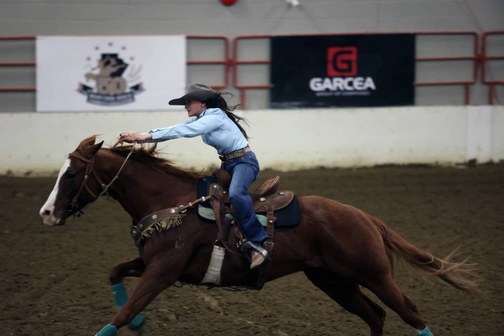 A competitor in the women’s barrel racing event takes part in the 2024 Manitoba Rodeo Cowboys Association finals. This year’s finals will be held Oct. 16-18 at the Assiniboine Credit Union Agricultural Centre. (Connor McDowell/The Brandon Sun files)
