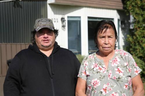 Brad Nielsen and Sharon Pompana stand outside their home in Brandon that had been without power for more than four months. (The Brandon Sun)