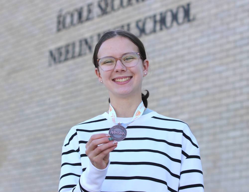 Zoe Forbes poses in front of Neelin with the bronze medal she won last week at the Manitoba High Schools Athletic Association's provincial high school cross-country championship in Winnipeg. (Perry Bergson/The Brandon Sun)
Oct. 14, 2025