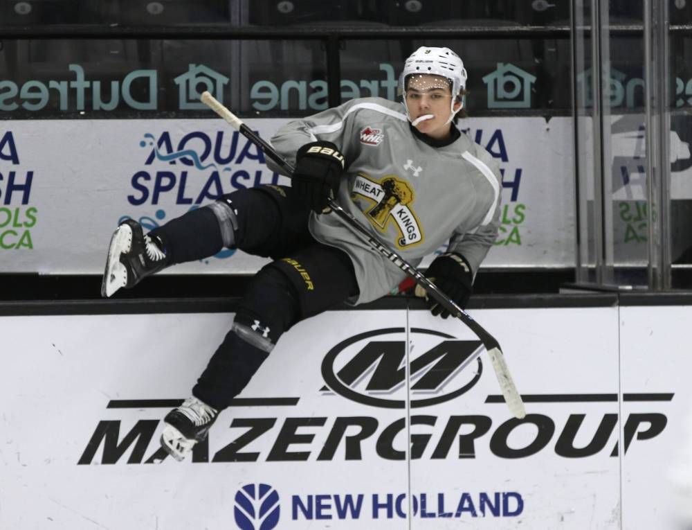Brandon Wheat Kings forward Jaxon Jacobson hops over the boards to join a drill at practice on Wednesday. Jacobson, who turns 17 in mid-December, said the team is making strides but needs to be better to start games. (Perry Bergson/The Brandon Sun)