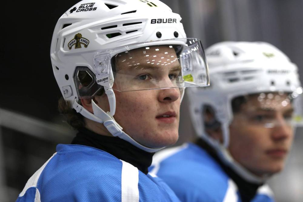 Brandon Wheat Kings rookie forward Chase Surkan, shown at practice on Wednesday with overage forward Nick Johnson sitting behind him, will play for Canada Red at the 2025 U17 World Challenge next month in Nova Scotia. He is leading the Wheat Kings in goals with six. (Perry Bergson/The Brandon Sun)