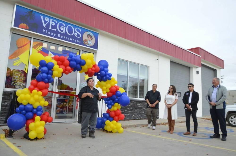 Catherine Vegos, left, welcomes everyone to the grand opening of Vegos Pinoy Restaurant in Neepawa in October. (Neepawa Banner & Press)