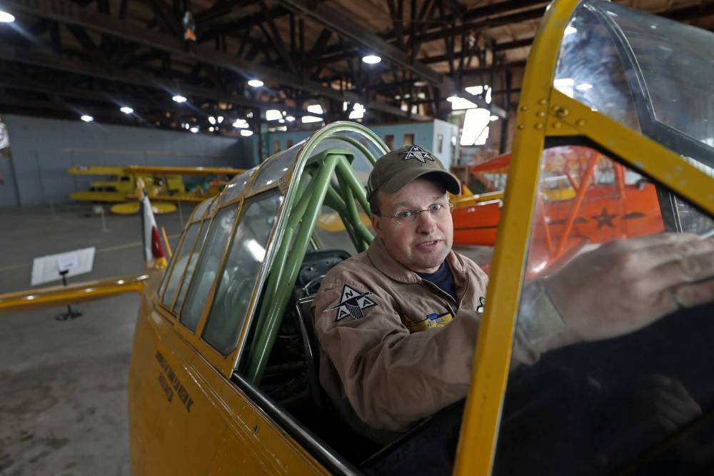 Jeff Bell sits in a Harvard MkII aircraft in the hangar of the Commonwealth Air Training Plan Museum in Brandon in October. (Connor McDowell/The Brandon Sun)