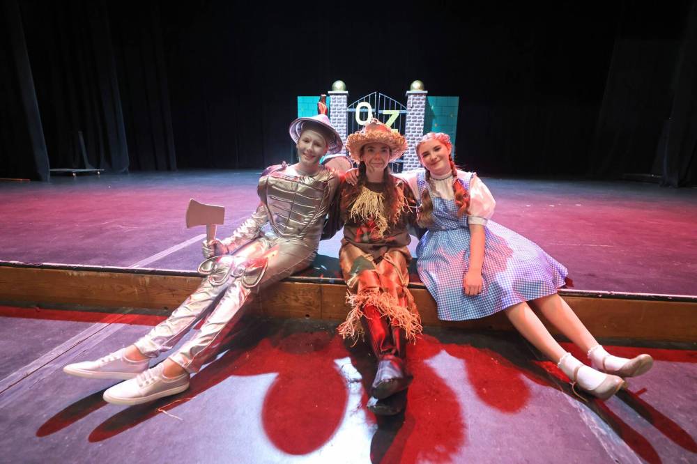 Tin Man Emily Gillespie (from left), Scarecrow Gillian Ginn-Desjarlais and Taylor Hall playing Dorothy pose for a photo during the Wednesday-evening dress rehearsal for Mecca Productions’ all-kids musical, “The Magical Land of Oz,” which opens tonight at the Western Manitoba Centennial Auditorium. (Photos by Matt Goerzen/The Brandon Sun)