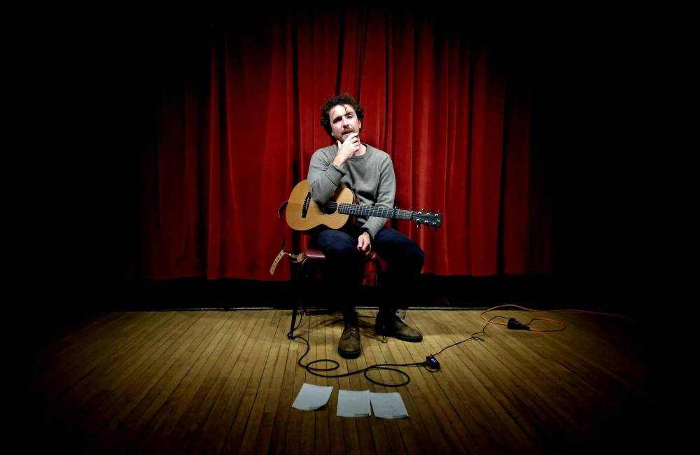 Sitting in the spotlight, Scottish singer-songwriter Michael McGovern speaks to a small crowd gathered at the Park Community Centre during his solo performance on Tuesday evening. (Photos by Matt Goerzen/The Brandon Sun)