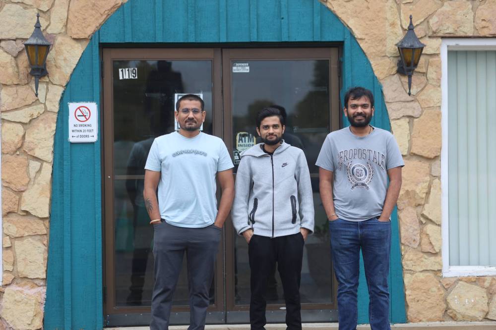 Shilo Inn managers Jackshil Patel (right) and his brothers, Priyank (centre) and Parth, stand in front of the business. (Abiola Odutola/The Brandon Sun)
