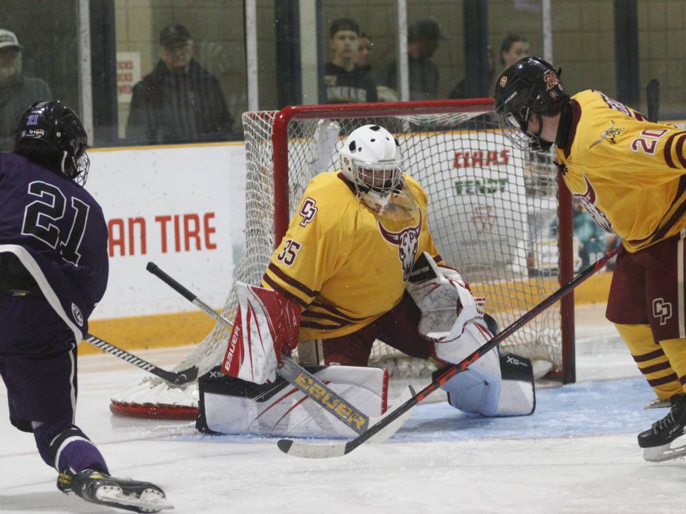 Plainsmen goaltender Cody Johnson (35), who came in relief of Colby Plewes midway through the contest, stops a shot off the stick of Massey forward Corwyn McLean. (Massimo De Luca-Taronno/The Brandon Sun)