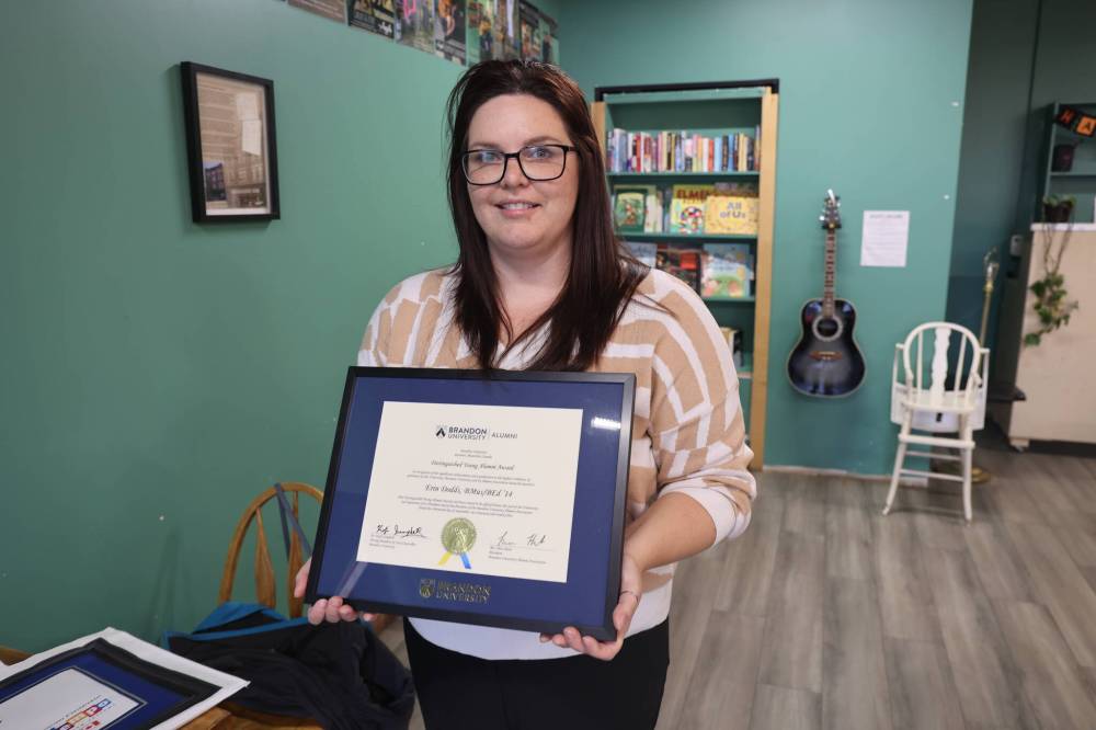 Earl Oxford School music teacher Erin Dodds shows her Brandon University Outstanding Young Alumni Award on Monday afternoon. (Abiola Odutola/The Brandon Sun)
