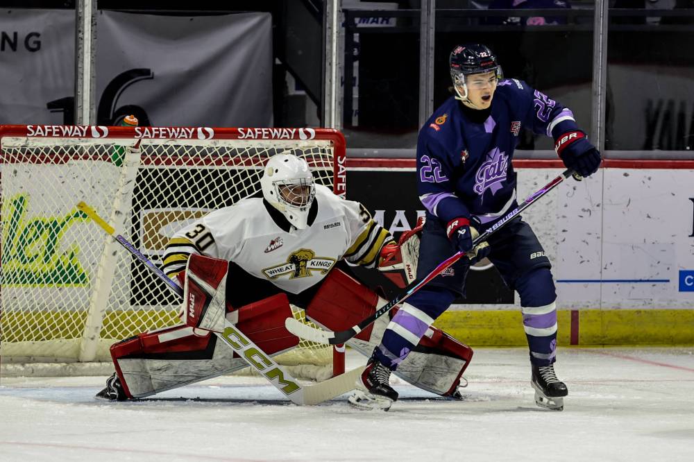 Brandon Wheat Kings goalie Filip Ruzicka (30) and Regina Pats forward Shea Rollason (22) watch the play develop during Western Hockey League action at Brandt Centre on Saturday. Regina won 6-4 in Ruzicka’s fourth appearance. (Keith Hershmiller Photography)