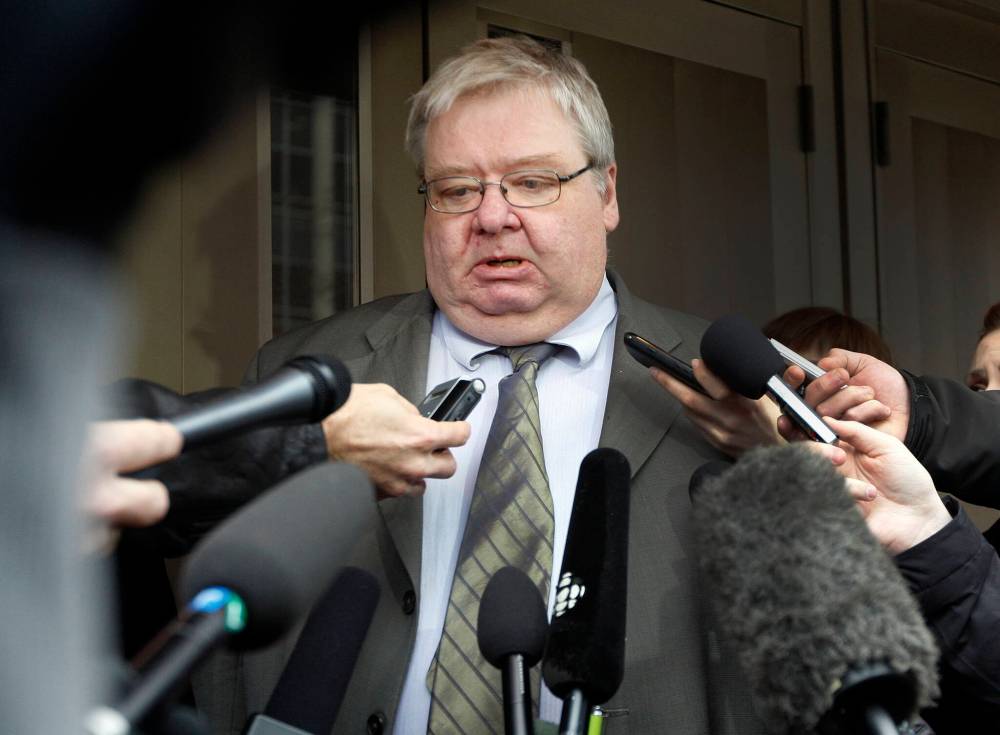 In this March 29, 2012 photograph, an emotional Mark Stobbe speaks to media before he walks away from the Winnipeg courthouse a free man after a jury acquitted him of second-degree murder in the death of his wife, Beverley Rowbotham. (Ken Gigliotti/Winnipeg Free Press files)