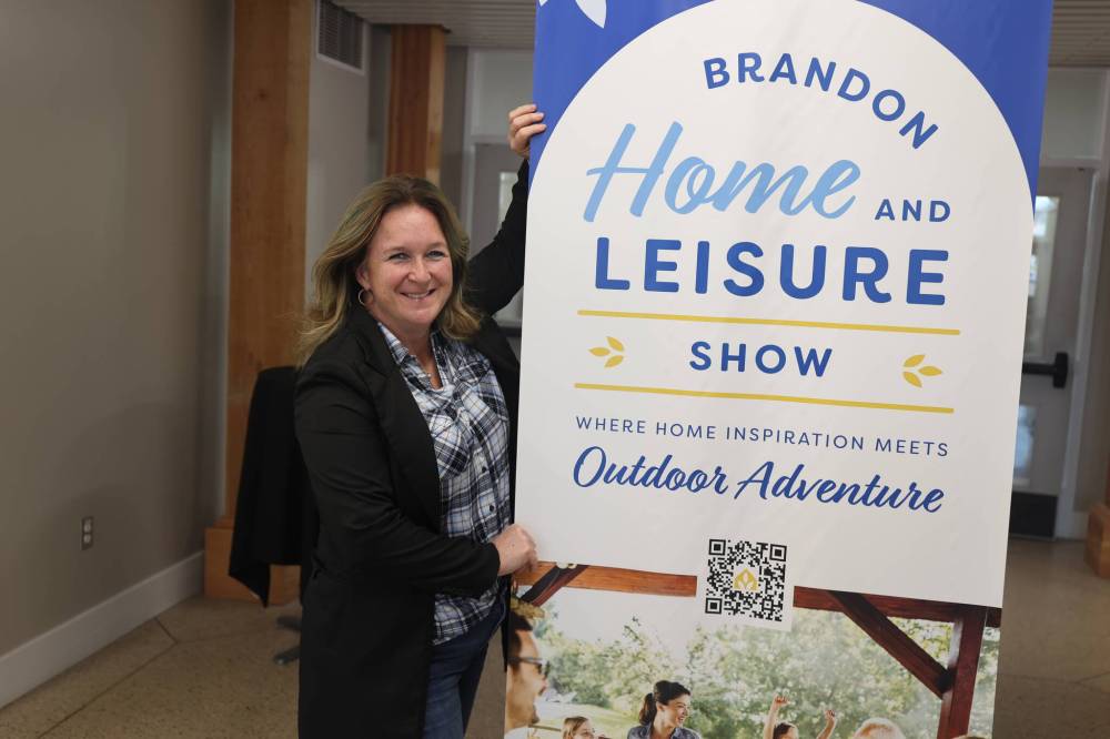 Provincial Ex acting general manager Kristen Laing Breemersch displays the new logo of the Brandon Home & Leisure Show in the hallway of the Dome Building on Friday afternoon. (Abiola Odutola/The Brandon Sun)