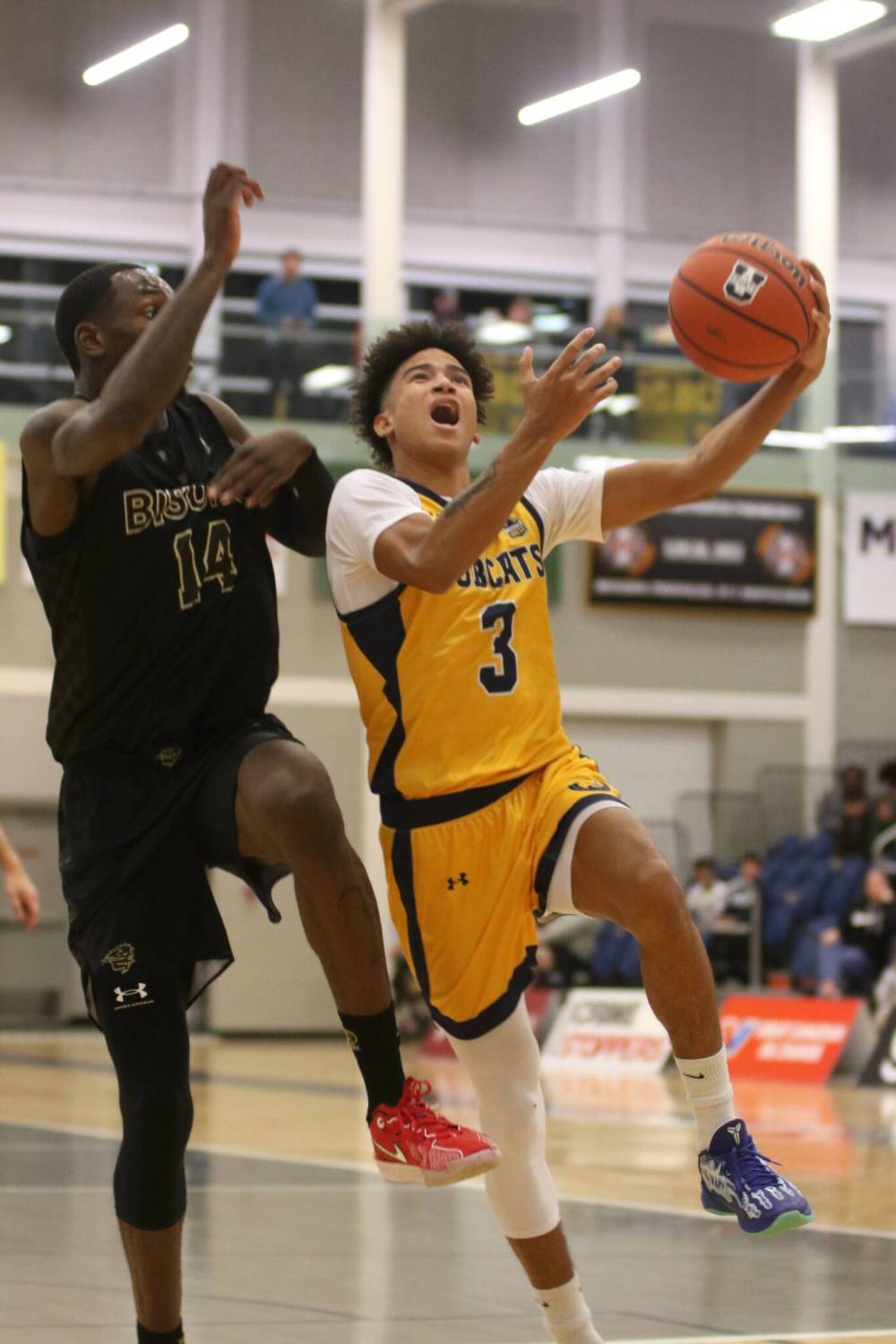 Brandon University guard Malik Brown drives against Ramogi Nyagudi of the Manitoba Bisons during their Canada West men’s basketball game at the Healthy Living Centre on Friday. (Thomas Friesen/The Brandon Sun)