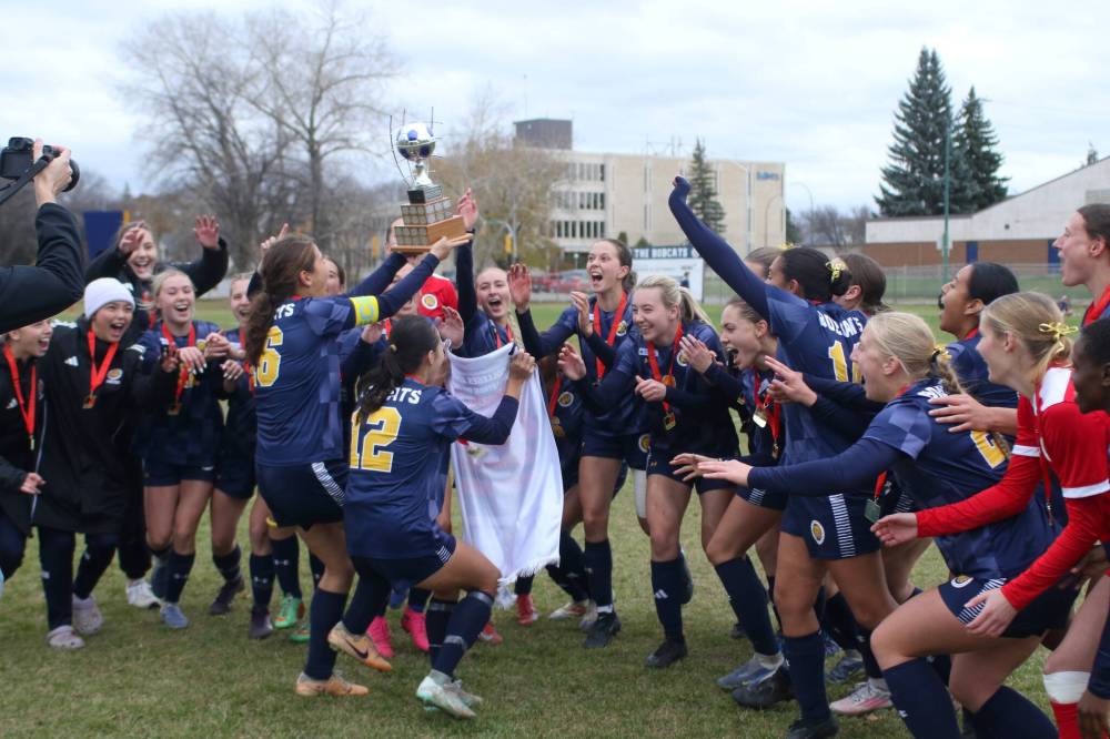The Brandon University Bobcats collect the MCAC women's soccer trophy for the third straight year at the Healthy Living Centre field on Sunday. (Thomas Friesen/The Brandon Sun)