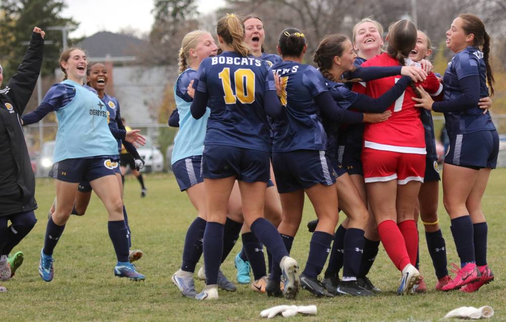 The Brandon University women's soccer team celebrates its MCAC women's soccer title at the Healthy Living Centre field on Sunday. (Thomas Friesen/The Brandon Sun)