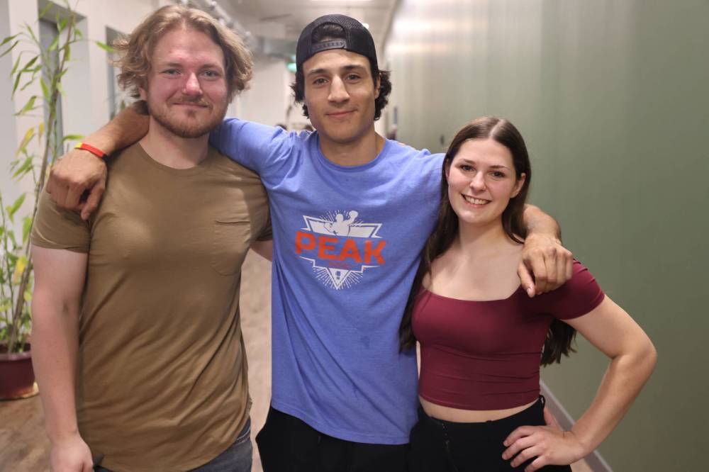 Brandon Fitness Combat Academy owner Ryker Batson (centre) with manager Logan Stouffer-Askham (left) and assistant manager Olivia Yurkiw-Keebie during the club’s annual Fall Brawl Boxing event on Saturday evening.