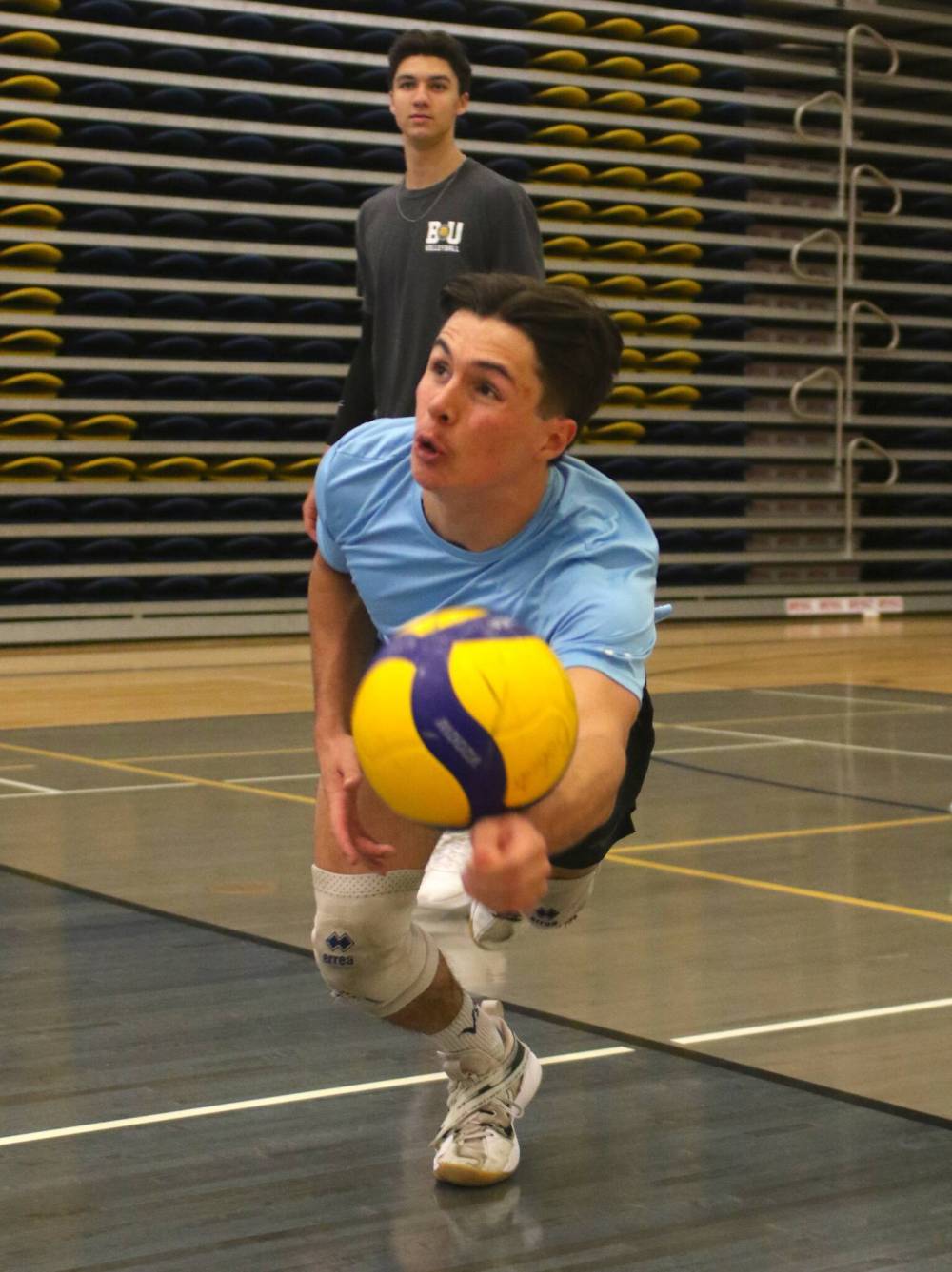 Libero Cooper Bevan dives to save a ball during practice on Thursday. (Thomas Friesen/The Brandon Sun)