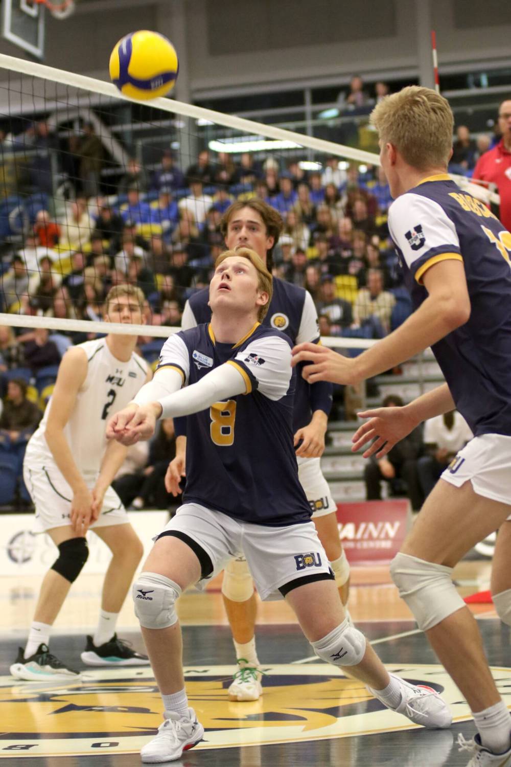Brandon setter Kale Fisher bump sets the ball against the Mount Royal Cougars during their Canada West men’s volleyball match on Friday. (Thomas Friesen/The Brandon Sun)