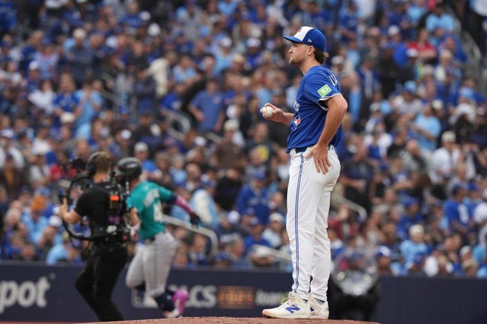 Toronto Blue Jays pitcher Trey Yesavage (39) looks on as Seattle Mariners centre-fielder Julio Rodríguez rounds the bases after hitting a three run home run during first inning American League Championship Series baseball action in Toronto on Monday, Oct. 13, 2025. THE CANADIAN PRESS/Frank Gunn