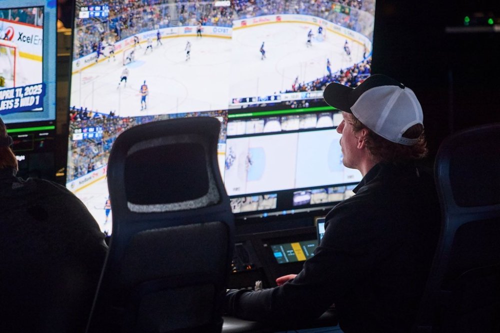 An NHL employee monitors a game from the league's situation room in Toronto on Tuesday, Oct. 28, 2025. THE CANADIAN PRESS/Sammy Kogan