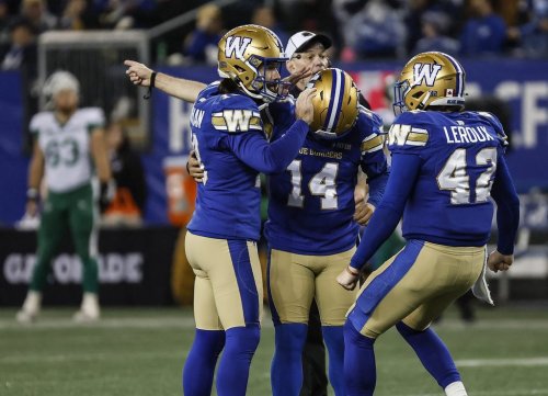 Winnipeg Blue Bombers' Jamieson Sheahan (18), kicker Sergio Castillo (14) and Ian Leroux (42) celebrate Castillo's game-winning field goal against the Saskatchewan Roughriders during second half CFL action in Winnipeg Friday, October 17, 2025.    THE CANADIAN PRESS/John Woods
