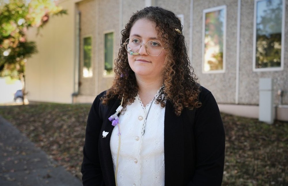 Animal rights activist Zoe Rosenberg, who is on trial for taking four chickens from one of Perdue Farms' major poultry plants, is pictured outside Sonoma County Superior Court in Santa Rosa, Calif. on Tuesday, Oct. 28, 2025. (AP Photo/Terry Chea)