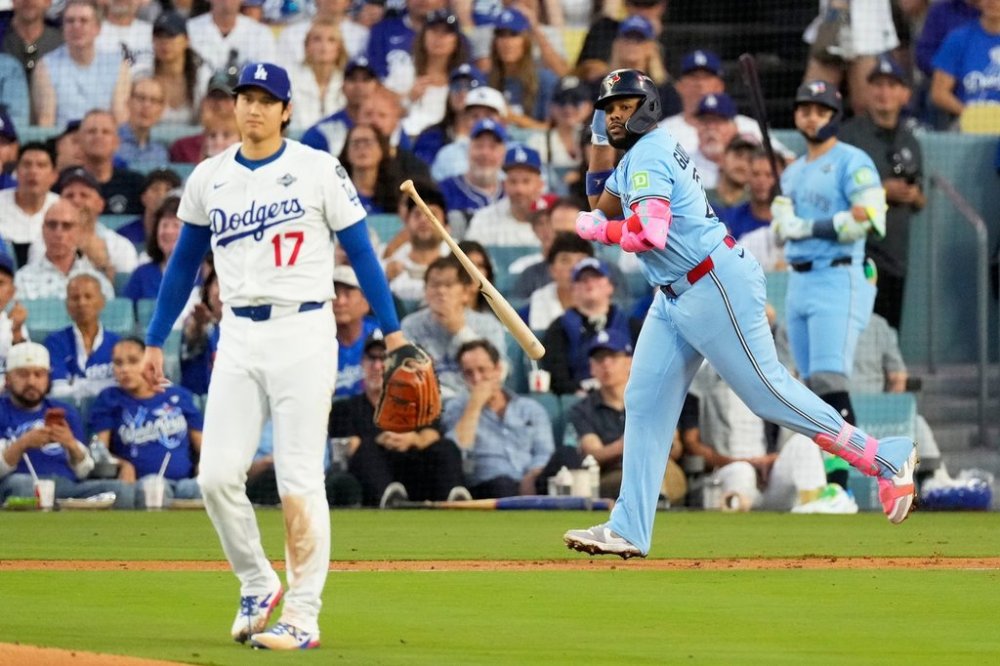 Toronto Blue Jays' Vladimir Guerrero Jr. hits two-run home run off Los Angeles Dodgers pitcher Shohei Ohtani during the third inning in Game 4 of baseball's World Series, Tuesday, Oct. 28, 2025, in Los Angeles. (AP Photo/Mark J. Terrill)