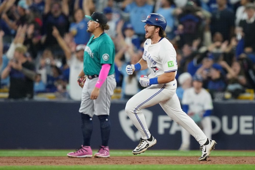 Toronto Blue Jays' Addison Barger (47) rounds the bases after hitting a two-run home run against the Seattle Mariners during third inning MLB American League Championship Series game 6 baseball action in Toronto, Sunday, Oct. 19, 2025. THE CANADIAN PRESS/Nathan Denette
