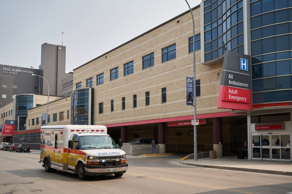An ambulance drives past Health Sciences Centre in Winnipeg on Thursday, June 15, 2023. THE CANADIAN PRESS/David Lipnowski