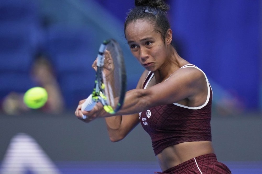 Leylah Fernandez of Canada plays a forehand return to Coco Gauff of the United States during a women's singles match of the China Open tennis tournament, at the National Tennis Center, in Beijing, China, Sunday, Sept. 28, 2025. (AP Photo/Mahesh Kumar A.)