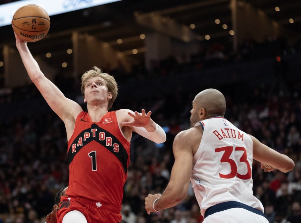 Toronto Raptors Gradey Dick (1) drives to the hoop against Los Angeles Clippers Nicolas Batum (33) during second half NBA action in Toronto, Sunday, Feb. 2, 2025. THE CANADIAN PRESS/Frank Gunn