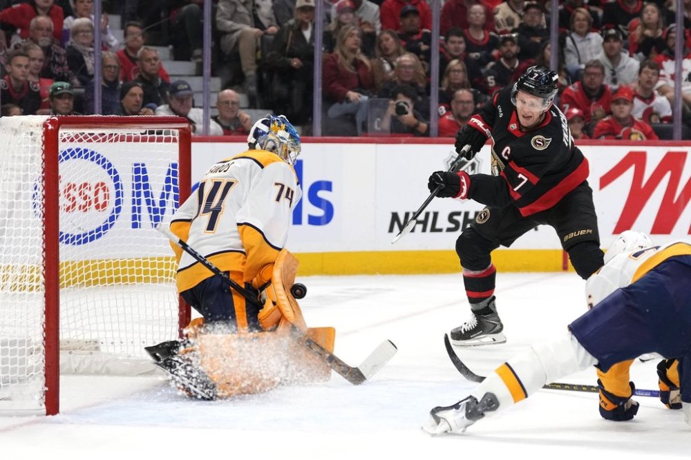 Nashville Predators goaltender Juuse Saros (74) makes a save on Ottawa Senators' Brady Tkachuk (7) during second period NHL hockey action in Ottawa, on Monday, Oct. 13, 2025. THE CANADIAN PRESS/Justin Tang