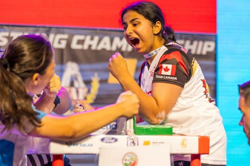 Iti Manchanda is shown in an arm wrestling match in this undated handout photo. THE CANADIAN PRESS/Handout — Iti Manchanda (Mandatory Credit)
