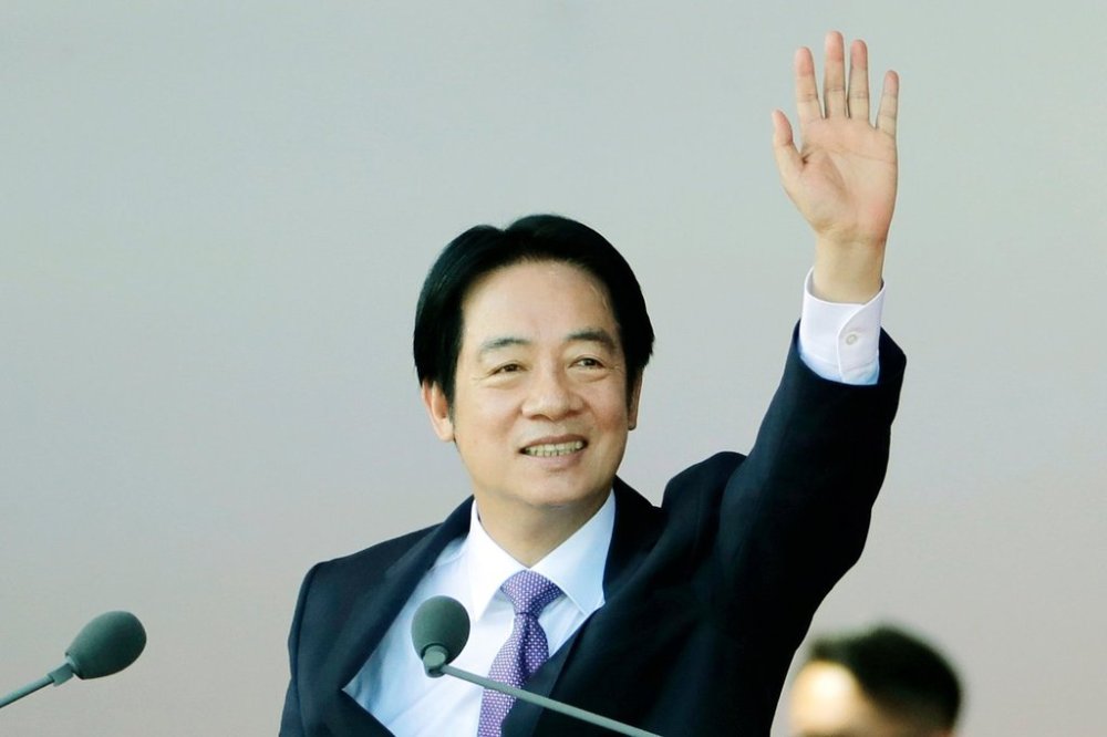 Taiwanese President Lai Ching-te waves during National Day celebrations in front of the Presidential Building in Taipei, Taiwan, Friday, Oct. 10, 2025. (AP Photo/Chiang Ying-ying)