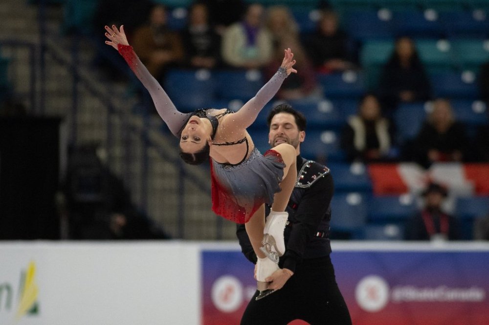 Deanna Stellato-Dudek and Maxime Deschamps of Canada skate in the Pairs Short Program in the 2025 Skate Canada International event in Saskatoon, on Friday, October 31, 2025. THE CANADIAN PRESS/Matt Smith