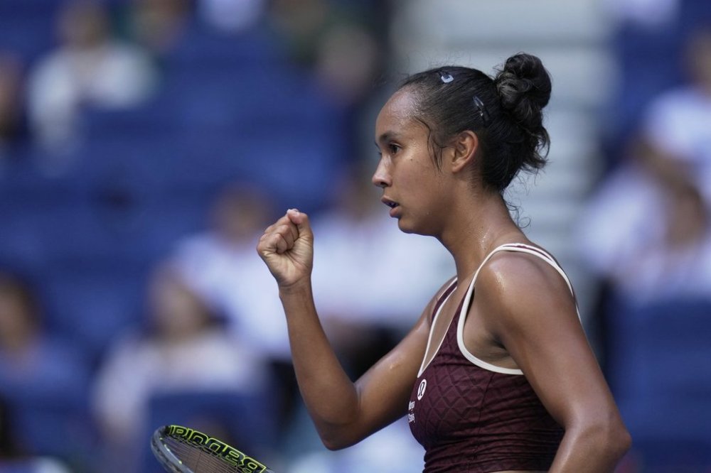 Leylah Fernandez of Canada reacts after scoring a point against Coco Gauff of the United States during a women's singles match of the China Open tennis tournament, at the National Tennis Center, in Beijing, China, Sunday, Sept. 28, 2025. (AP Photo/Mahesh Kumar A.)