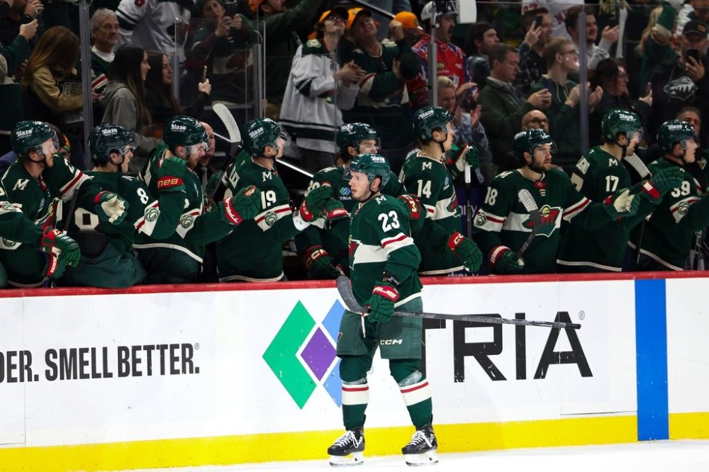 Minnesota Wild centre Marco Rossi (23) celebrates at the bench after scoring a goal during the second period of an NHL hockey game against the Vancouver Canucks, Saturday, Nov. 1, 2025, in St. Paul, Minn. (AP Photo/Ellen Schmidt)