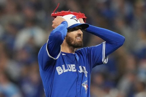 Toronto Blue Jays pitcher Kevin Gausman reacts after giving up a home run to Seattle Mariners catcher Cal Raleigh during sixth inning American League Championship Series baseball action in Toronto on Sunday, Oct. 12, 2025. THE CANADIAN PRESS/Chris Young